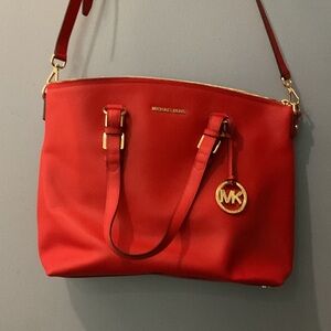 Michael Kors Red Shoulder Bag with Gold Accents tote bag.